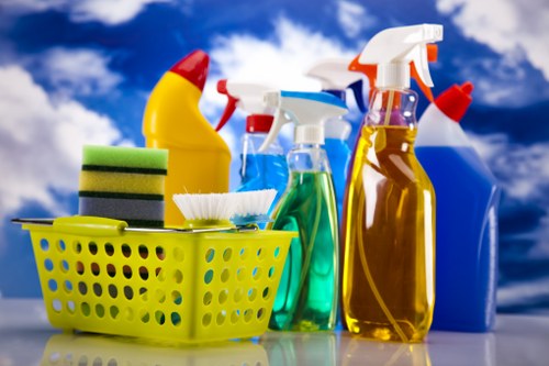 Specialist upholstery cleaning tools used on a fabric armchair